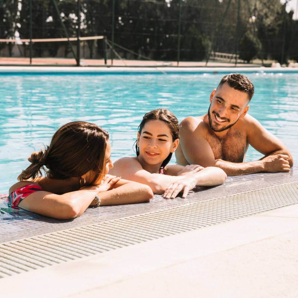friends relaxing in swimming pool